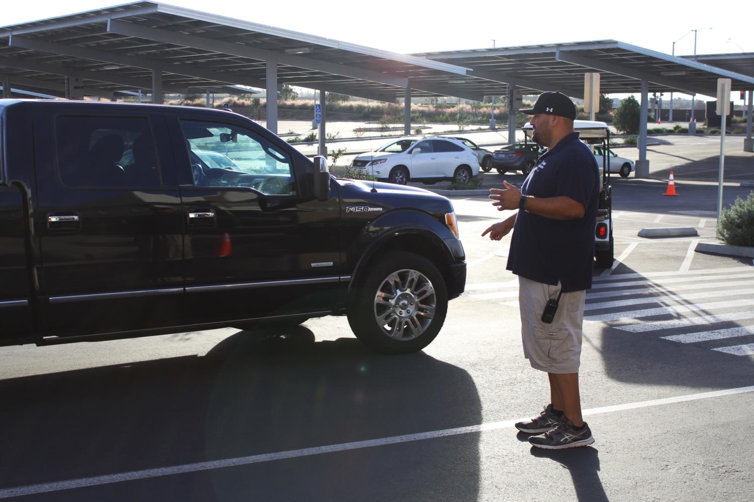 Campus control assistant George Mares ensures that drivers in our school parking lot are safe to prevent any injuries.