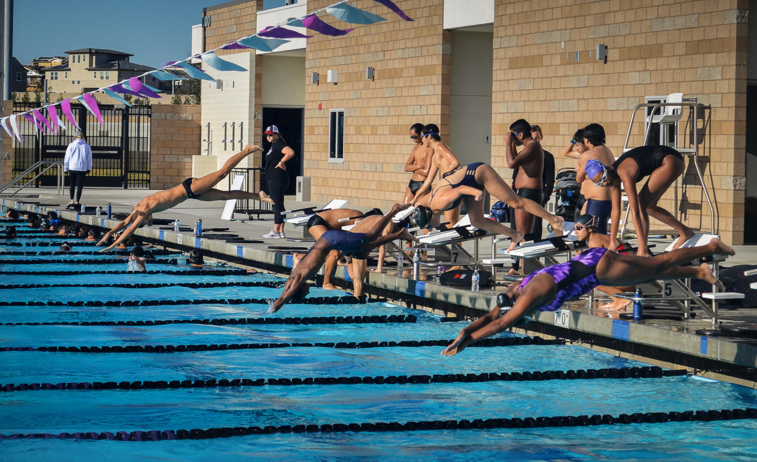 Lined up at the blocks, swimmers leap into the water and swim one lap of each stroke with 10 seconds between each set of swimmers.