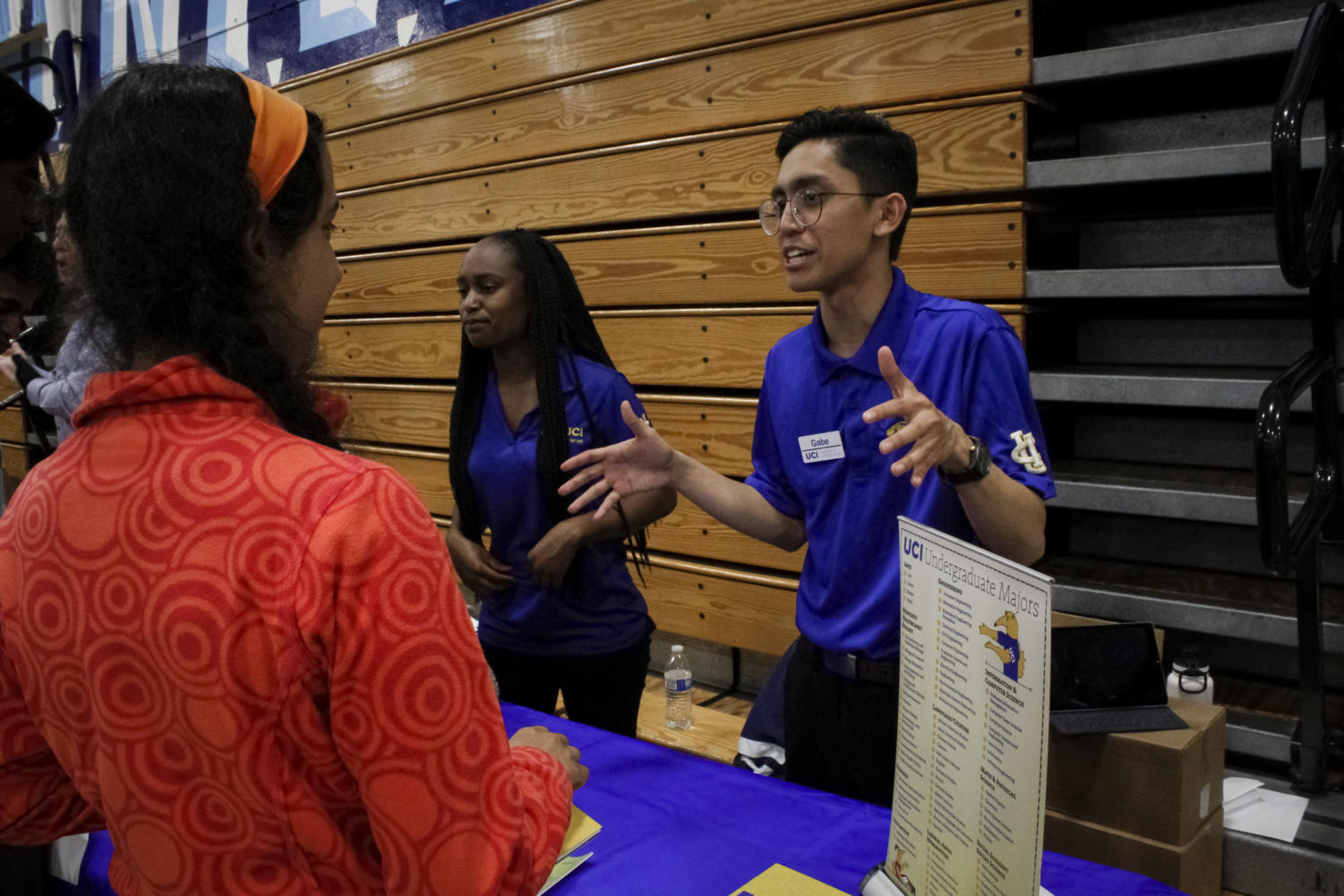 Sophomore Samira Feili speaks with a University of California, Irvine student regarding science majors offered at the institution.