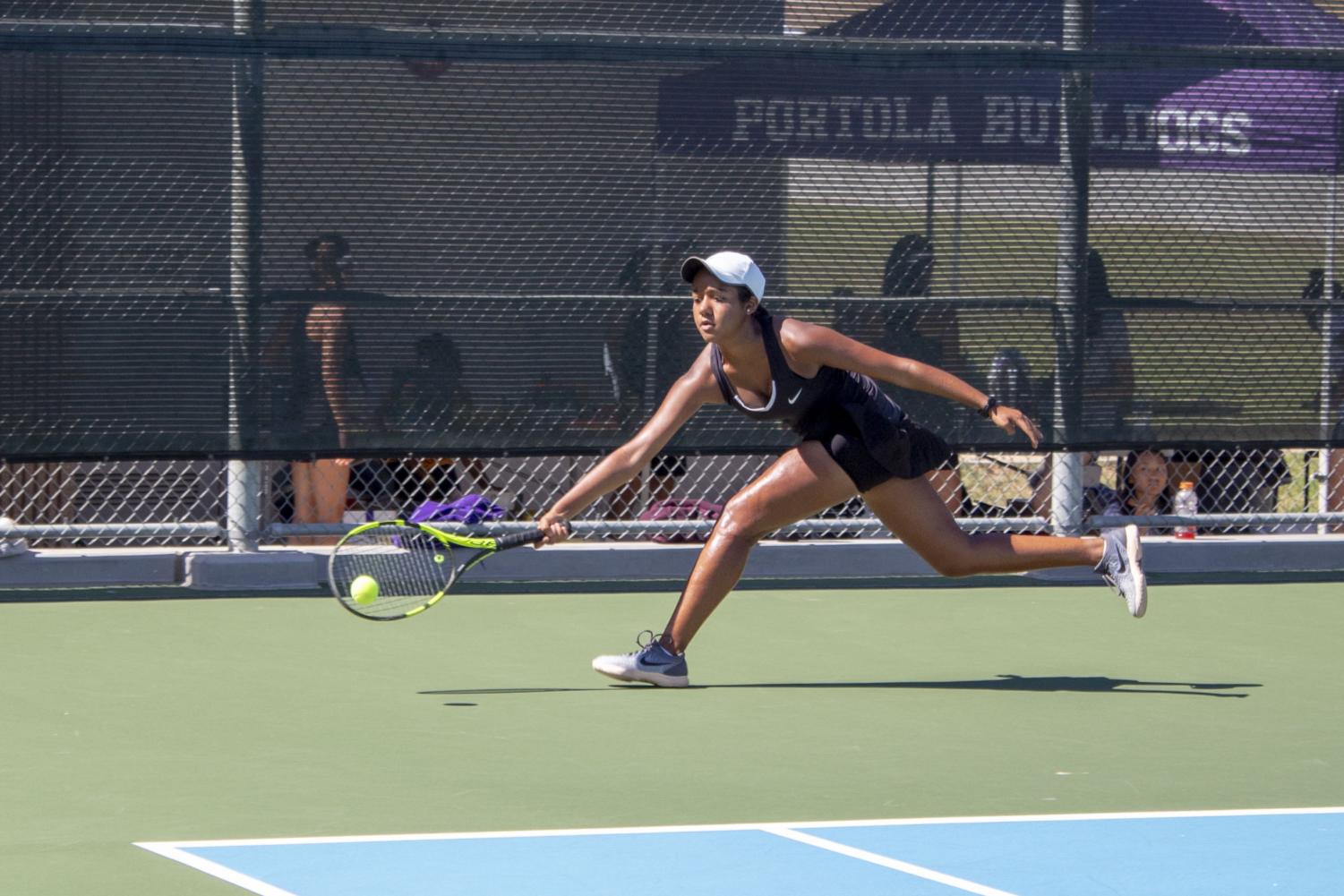 Just getting there in time, freshman Saachi Pavani returns a powerful crosscourt shot to win the point.