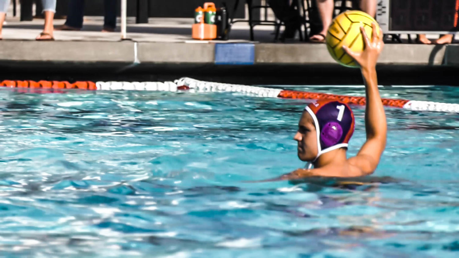 Junior and captain Leo Pena palms the ball, keeping it up and ready to be passed to a fellow teammate as his legs powerfully eggbeat beneath him to keep afloat. Pena's eyes are narrowed and defenses raised, ready to respond with a sudden burst of power depending on the situation around him.