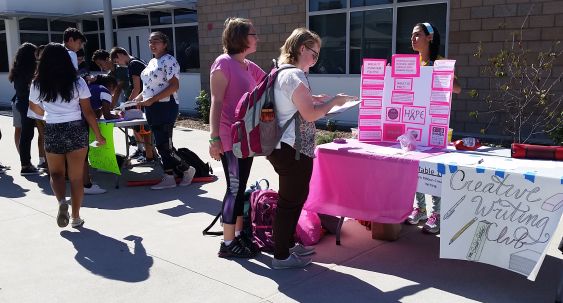 Samira Feili, pink ribbon club president, explains to students through an interactive activity the club’s mission to fight breast cancer.  