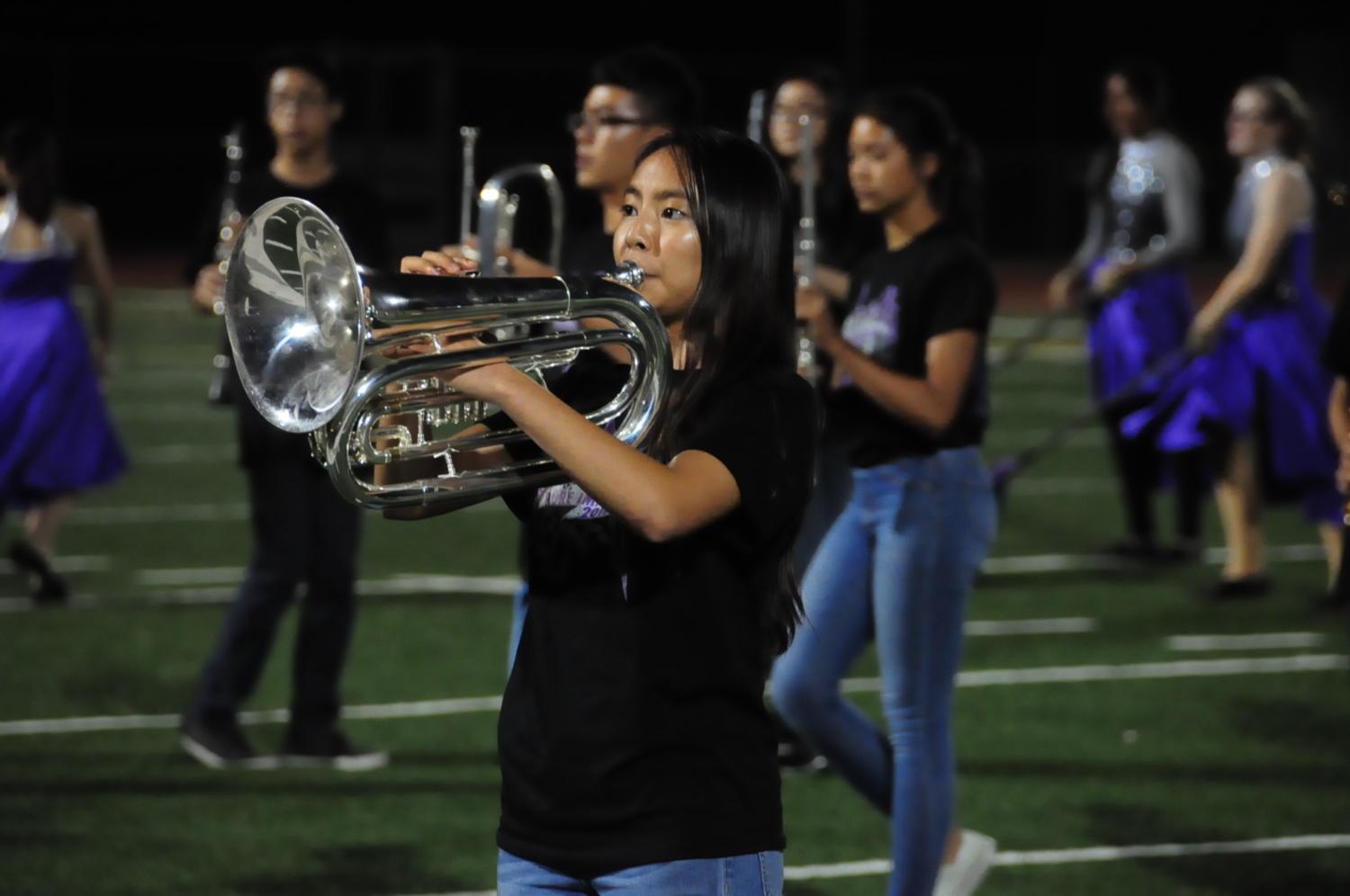 Baritone section leader Stephanie Tang plays a solo during the marching band performance of “Pure Imagination.