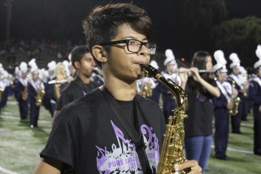 Marching band member and freshman Rishav Sen plays Louie Louie at the finale.