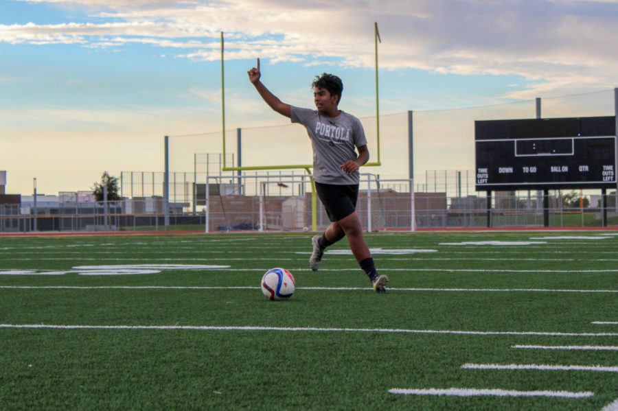  Sophomore Zaid Khan signals to his teammates as he gains possession of the ball.
