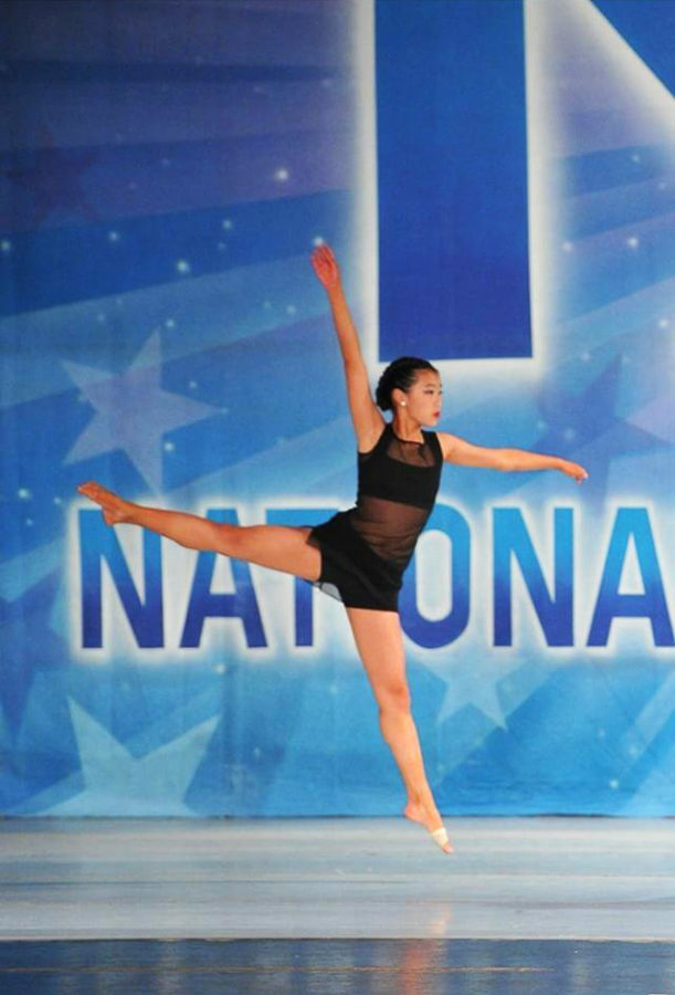 Katelyn Chin dances at KAR National Dance Competition, effortlessly jumping in a jeté. 