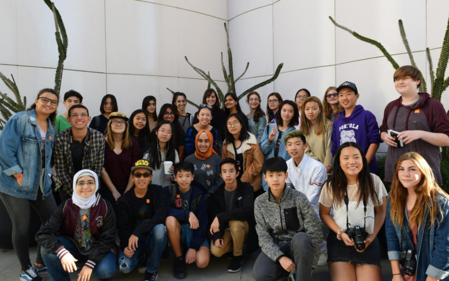 Art students pose before entering LACMA, holding cameras and journals to document their unique experience. 