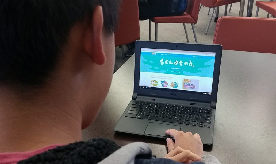 Chen works with the Scratch program to create games, such as a ball moving through a maze.