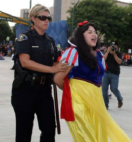 Office Jennifer Johsen arrests a Disneyland actress dressed up like Snow White who was protesting at a labor rally. 