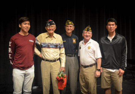 Sophomores Garrett Lim and Patrick Cui take a photo with World War II veterans Bill Hamilton, Loren Major and post commander of The Veterans of Foreign Wars Wayne Yost after the veterans reflected on their experiences in a presentation to the community.