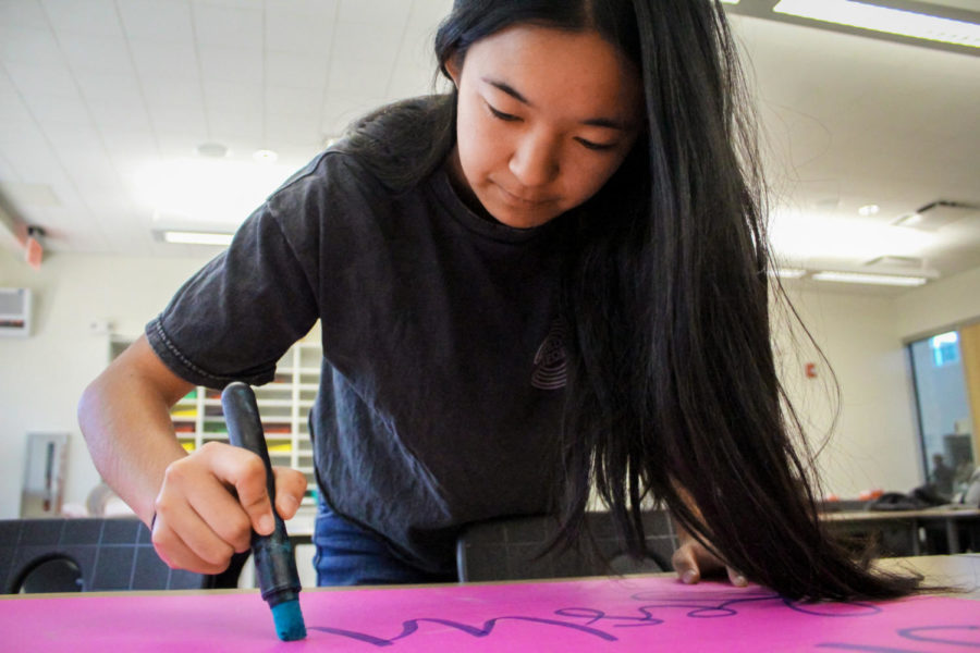 As the publicity commissioner, sophomore and ASB member Allison Shi works on one of many posters advertising the spring carnival that will be displayed around campus.