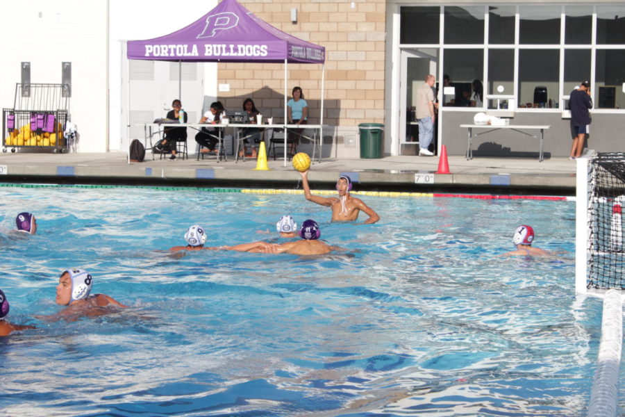 Boys’ water polo captain Belal Ibrahim takes aim at University High’s goal during second half of the game.