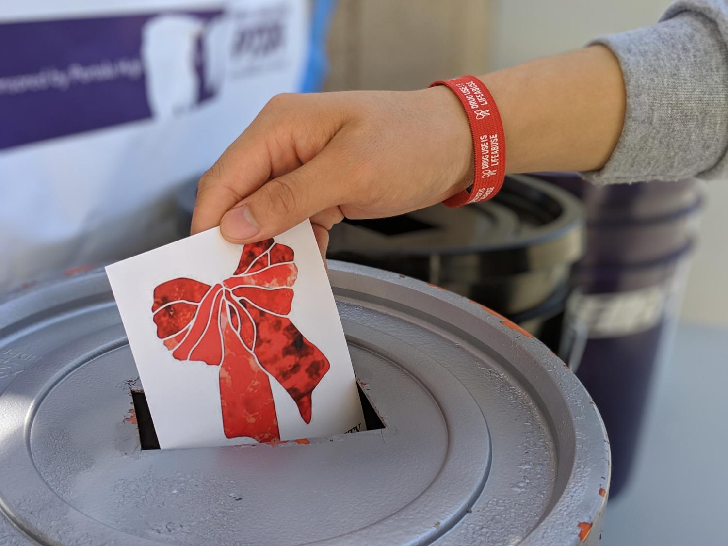 The Red Ribbon was first worn in 1985 in response to the death of drug-enforcement agent Enrique Camarena and has since served as the symbol of drug prevention, according to the United States Drug Enforcement Agency.