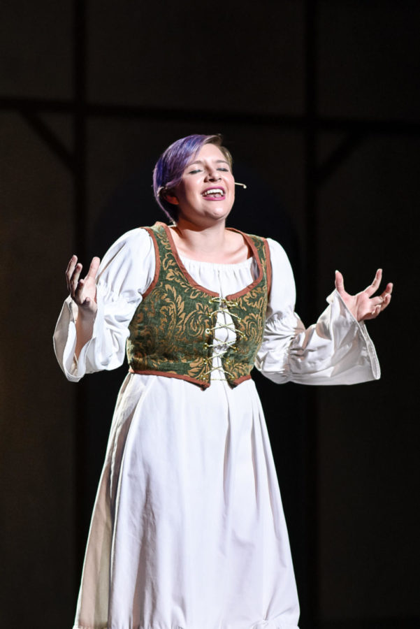 Junior Hannah Siekmann, who played Beatrice in “Much Ado About Nothing,” emotes with her tone of voice and facial expressions her love for Benedick (junior Alex Frend), her witty male love interest.
