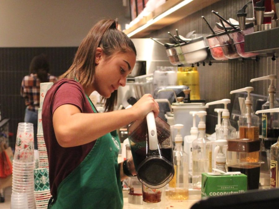 From five p.m until nine p.m, junior Neha Scott dons her classic green Starbucks apron and prepares drinks for her customers, adding intricate swirls of sweet syrup and puffs of whipped cream. In addition, she mans the cash register and baristas, gracefully carrying out her heavy workload.  