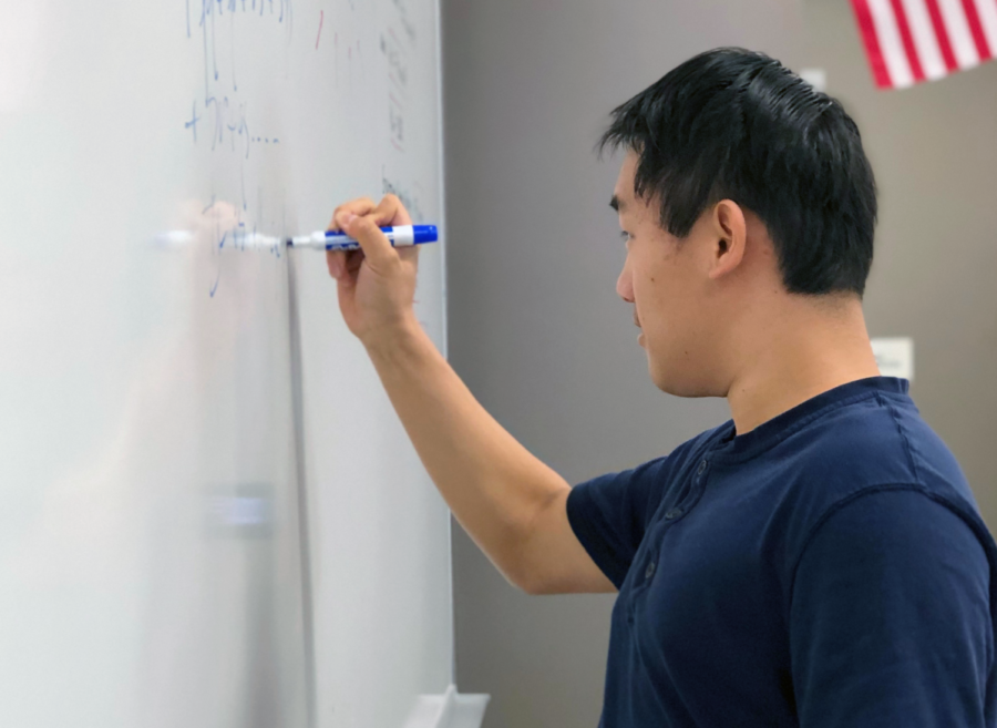  Junior Joyee Chen uses the whiteboard to tackle tricky problems by visually interpreting the question.