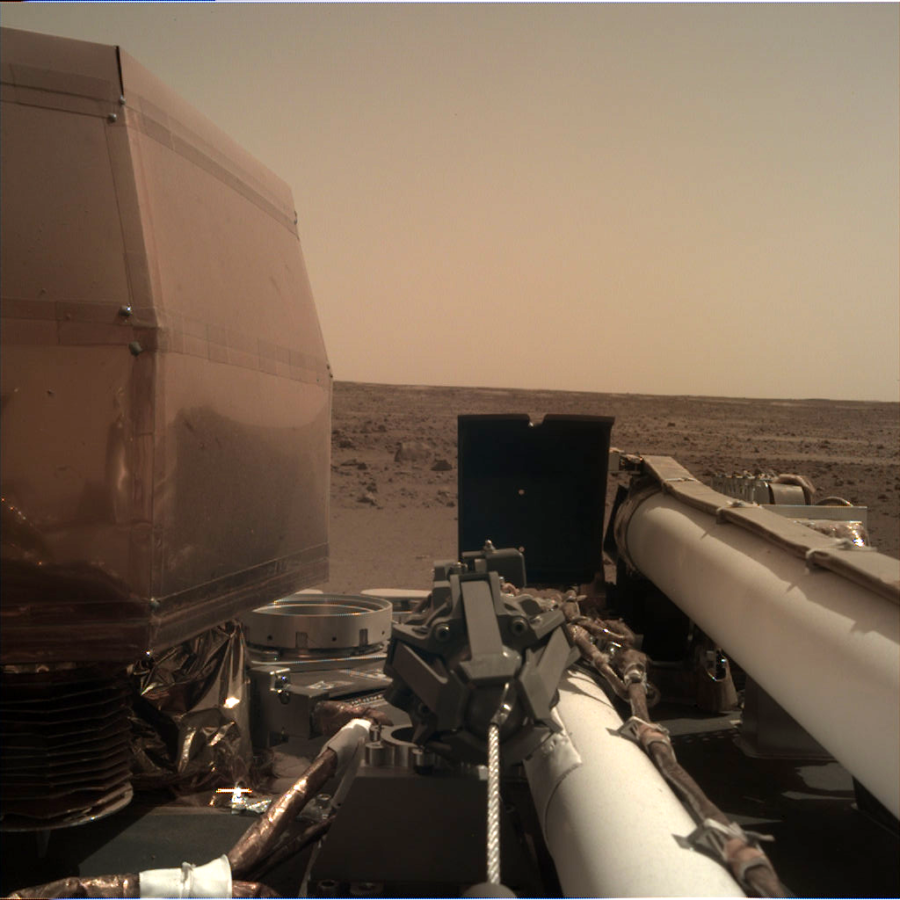 Insight lands and takes a picture using its Instrument Deployment Camera (IDC) from the surface of Mars.