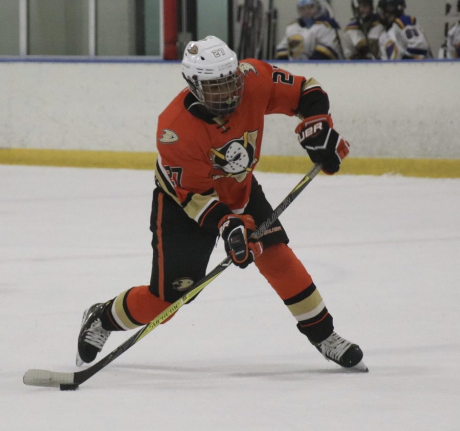 In a rapid counter attack, Manan Mendiratta prepares to slap the puck across the ice into the netting. His travel team, the Anaheim Junior Ducks, is one of the top three in California. 