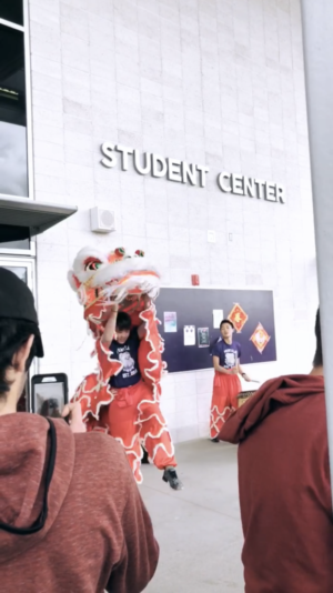 Chinese 3 students perform a vivid, southern-style traditional lion dance to represent prosperity and harbor good luck for the new year.