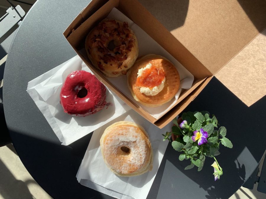Oliboli offers a range of flavors atypical of most doughnut stores, 
such as (going clockwise) Bumbleberry, Burnt Butter Bourbon Bacon,
Fry Bread with Meyer Lemon and Guava Jam and Lavender Sugar.