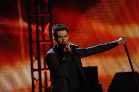 During the Super Bowl halftime show, Adam Levine performed live with his band Maroon 5 to over 70,000 people, with an additional 100 million watching at home.
