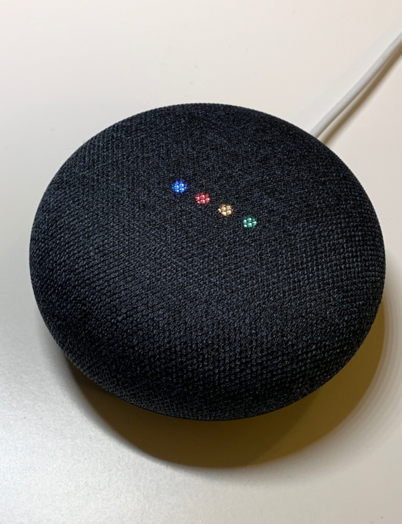 This Google Home Mini’s set of iconic lights activate by their trigger phrase, “Hey Google,” ready for any command.