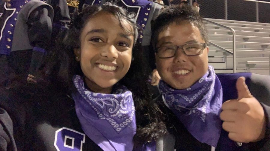Sophomores Pranathi Kollolli and Joshua Ong celebrate at one of the football games this year. The pair were members of the marching band pit section this year and spent time working together, playing cymbals, and enjoying the experience
