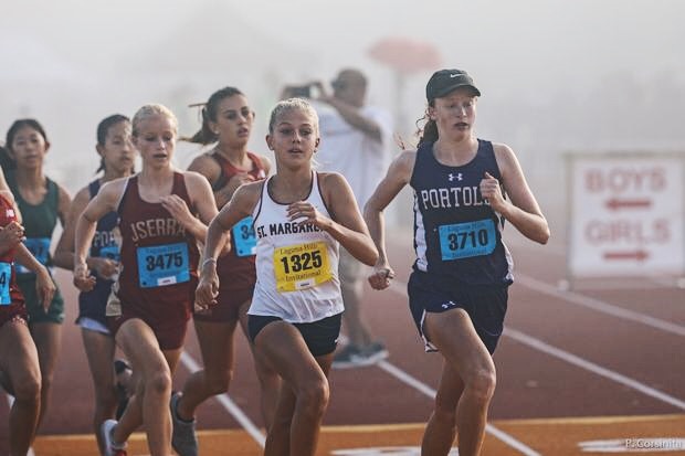 Jadyn Zdanavage (right) takes the lead at the Laguna Hills Invitational on Sept. 14. As a freshman, she holds the spot of fastest female runner in the Pacific Coast League and is ranked ninth for her grade in the entire state of California.