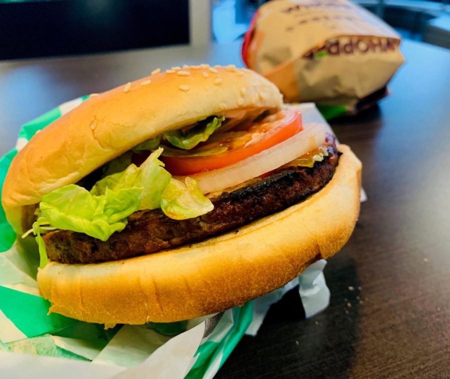 Burger King’s Impossible Whopper is a vegetarian spin on the regular Whopper, retaining the same familiar tomatoes, onions, pickles and lettuce while substituting the beef patty with an Impossible Meat vegan one.