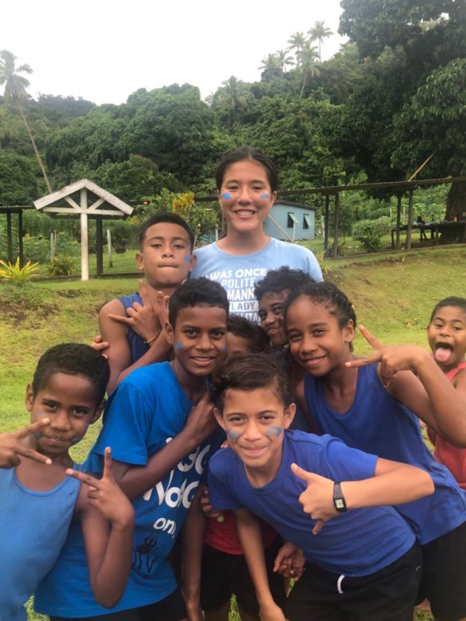  Kai Wong smiles for the camera with children from the small village of Toga, Fiji. She spent 16 days on the trip, where she participated in restoration projects and cultural activities.