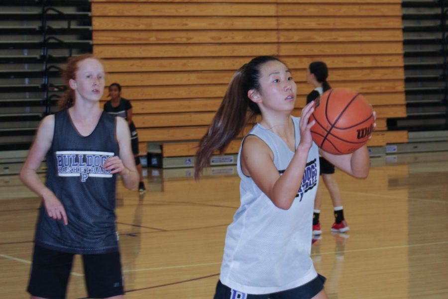 Freshman Moka Saiki shoots a two-point shot during practice to prepare for the upcoming winter season. The next varsity girls’ basketball game will be on Nov. 21 at 7 p.m. against Capistrano Valley High.