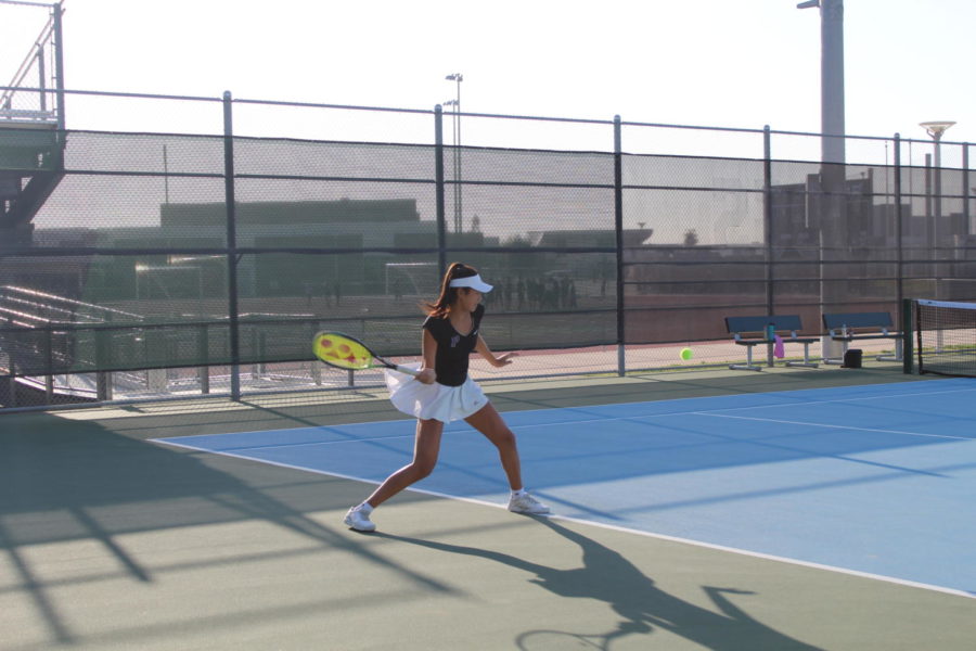 Freshman Anne Yang drives a forehand crosscourt after a short ball from her opponent. Yang went on to win the point and later win her match 6-0 against Trabuco Hills High’s number two player. 
