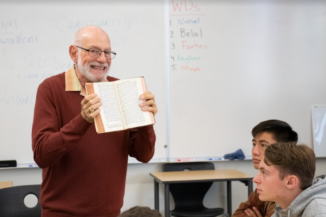 Showing his copy of the Torah written in Hebrew, Rabbi Stephen Einstein helps students understand how translation of scripture from one language to another alters interpretations of religious ideas throughout history. Continuing the series, three more guest speakers will visit to talk about their respective religions: a speaker on Buddhism on Dec. 3, Mormonism on Dec. 5 and Islam on Dec. 17.