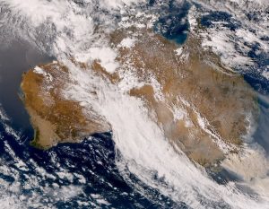 The Australian megafires as seen by the Himawari 8, a Japanese weather satellite show the overhead conditions of the continent. Smoke from the fires in Australia has reduced air quality, forcing citizens to evacuate, and has reached as far as Chile, according to NPR.	