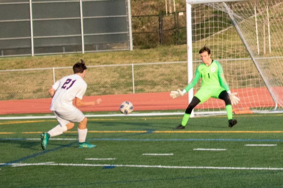 Senior Ethan Dru saves a shot on goal, just one of the many scoring opportunities he took away from Beckman High.