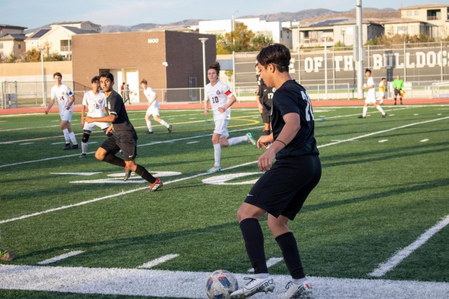 Junior Isaac Betancourt passes the ball to senior Anirudh Chaudhary, a prime example of Portola’s possession based offense.
