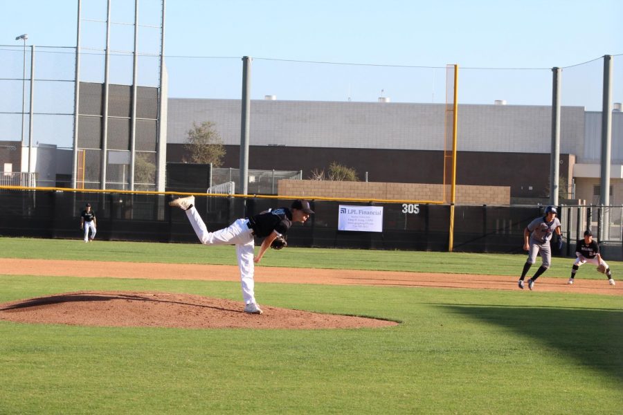 The force of senior and pitcher Jamison King’s fastball launches his upper body forwards. King’s standout grit and performance has been consistent since freshman year, according to coach Kevin Conlin.