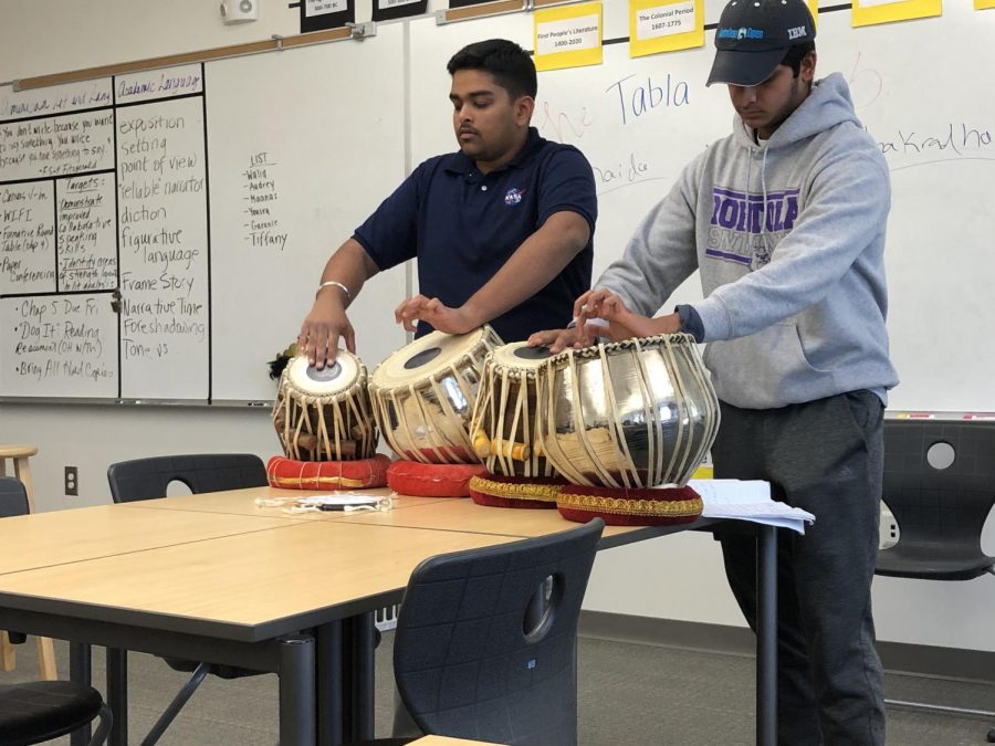Club president and senior Harpreet Saluja and vice president and junior Yash Fatehpuria of the Tabla Club show their talents on the tabla, an instrument that has provided classic music for Indian culture throughout its history. 