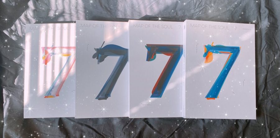 BTS’s “Map of the Soul: 7” features four versions, all with different colored covers, including shades of pink and white, blue and black, blue and red, and blue and orange. The number “7” symbolizes the seven members of the group as well as the number of years they have been together.