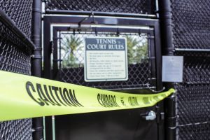 A local tennis court in Portola Springs is blocked with caution tape. The stay-at-home order left the usually packed courts vacant on a Saturday afternoon.