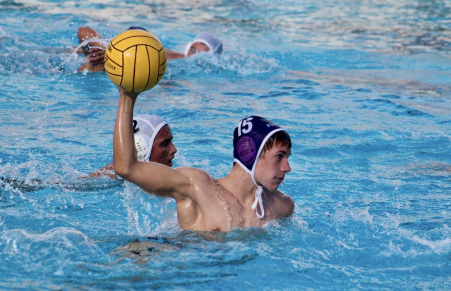 Pictured+here+preparing+to+move+the+ball+forward%2C+varsity+water+polo+player+Andrew+Cherry+often+sets+himself+to+hours+of+athletic+practice+each+day.+An+integral+part+of+each+junior+varsity+game+in+last+years+season%2C+Cherry+looks+to+lead+by+example+in+his+dedication+at+the+varsity+level.