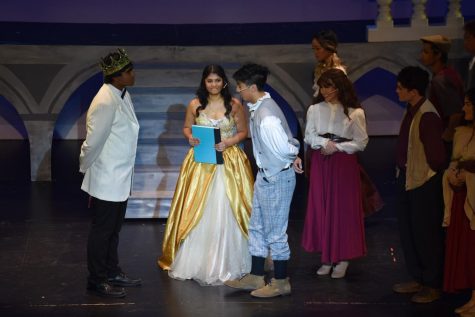 The cast of Cinderella practice their lines during after school rehearsals while sharing a fun moment. Despite the long and oftentimes stressful hours, the actors work together and stay committed to perfect their performance.