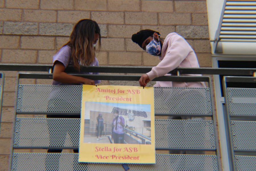 Vice+president+candidate+and+junior+Stella+Jung+and+newly+elected+ASB+president+and+junior+Amitoj+Singh+hang+posters+around+Portola+High+to+publicize+their+campaign.+ASB+candidates+used+a+combination+of+posters+and+flyers+and+hung+them+on+stairwells+and+bulletin+boards.+