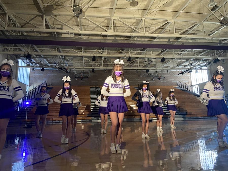 Senior Emily Wei takes center stage in cheer’s performance of the song “Ready to Ride,” which they have been learning since February. 
