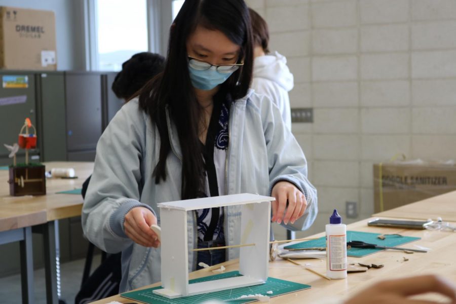 Senior Natalie Yu constructs a prototype of a small mechanical ‘automata box’ during Introduction to Engineering Design, which was first introduced as a course option for the 2020-21 school year. The debut of Principles of Engineering next school year is the second step of a collaborative effort between engineering teacher Anthony Pham, principal John Pehrson and IUSD’s ROP/CTE division to create an engineering pathway for Portola High students.