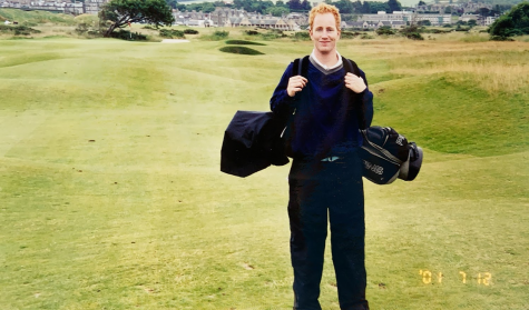 While on a trip to the United Kingdom, a newly college-graduated Wind Ralston stands on the St. Andrews golf course, which is regarded as the birthplace of golf in the 15th century, according to Guinness World Records.
