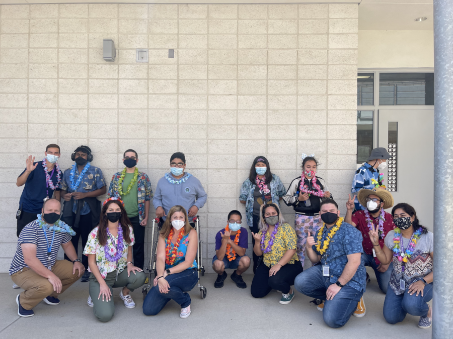 Special education students and staff members dress up for the Hawaii CBI event by wearing leis and hawaiian shirts. During the CBI activity, they answer like, “What would you eat in Hawaii?” 