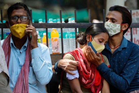 Relatives who lost a family member due to the Coronavirus surge are outside Lok Nayak Jai Prakash Narayan hospital in New Delhi on April 21, according to the Associated Press. New Delhi has become a major hotspot during the surge. 