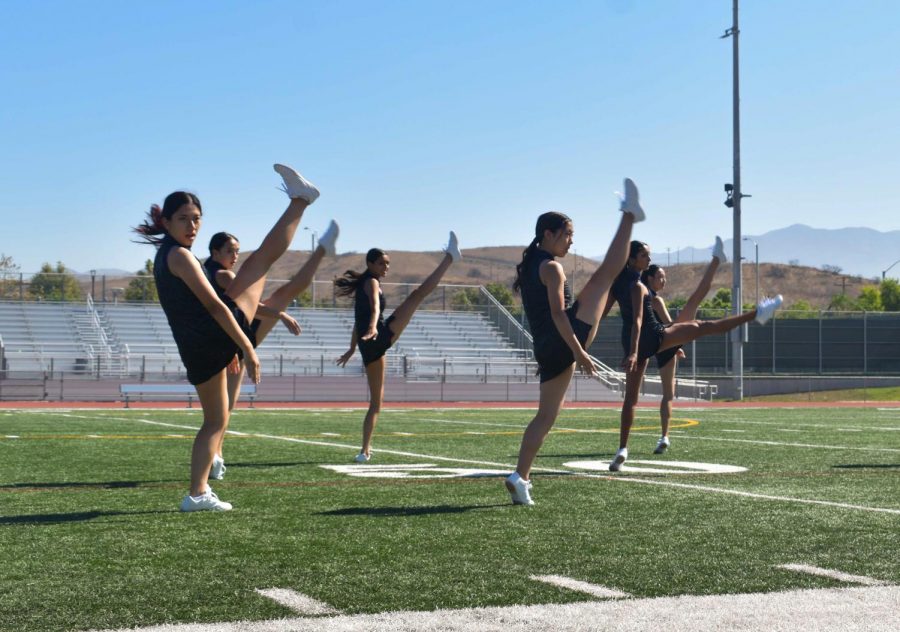 Nine Dance Company members perform their jazz routine, which was set to “Edge of Midnight” by Miley Cyrus. They learned the choreography while attending the USA Dance and Spirit camp in early August but proceeded to practice it during class and office hours once school began, according to Dance Company co-captain and senior Elena Kim.
