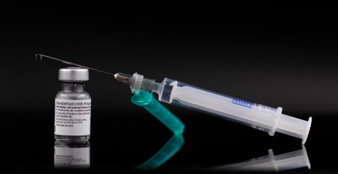The Pfizer-BioNTech Covid-19 vaccine, shown here with a syringe, could expand its accessibility to children ages 5-11 if the FDA approves its request for authorization. The vaccine is already available for those 12 and over, and booster shots are available per CDC criteria.